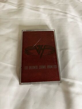 Warner Bros. Electronics Other cassette — deep red with black logo